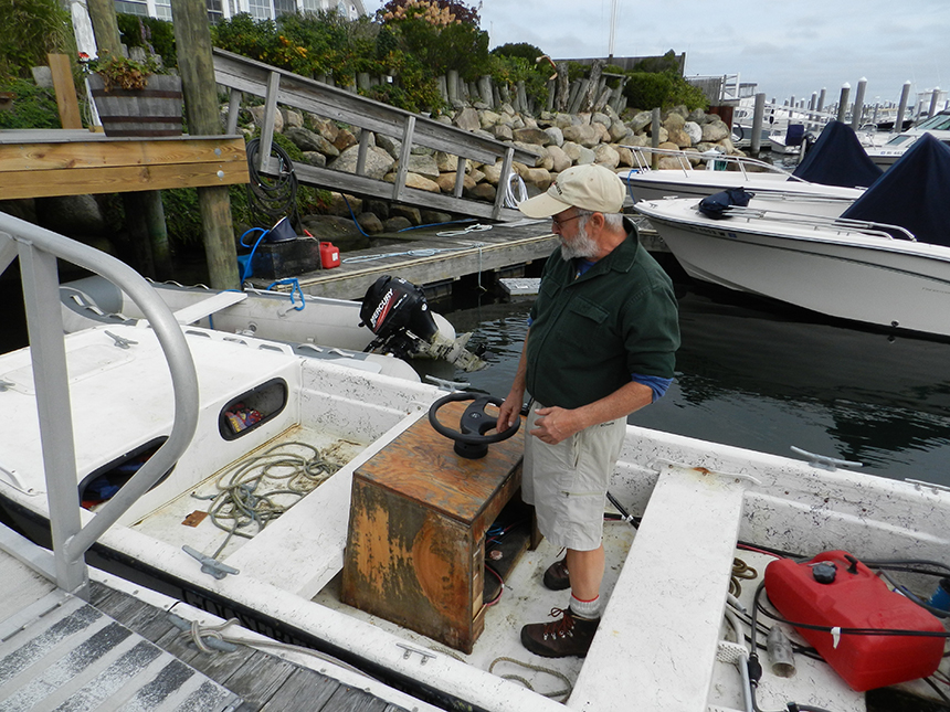 David Blaney in a boat he’ll use to support his kelp operation, in the marina managed by his brother.