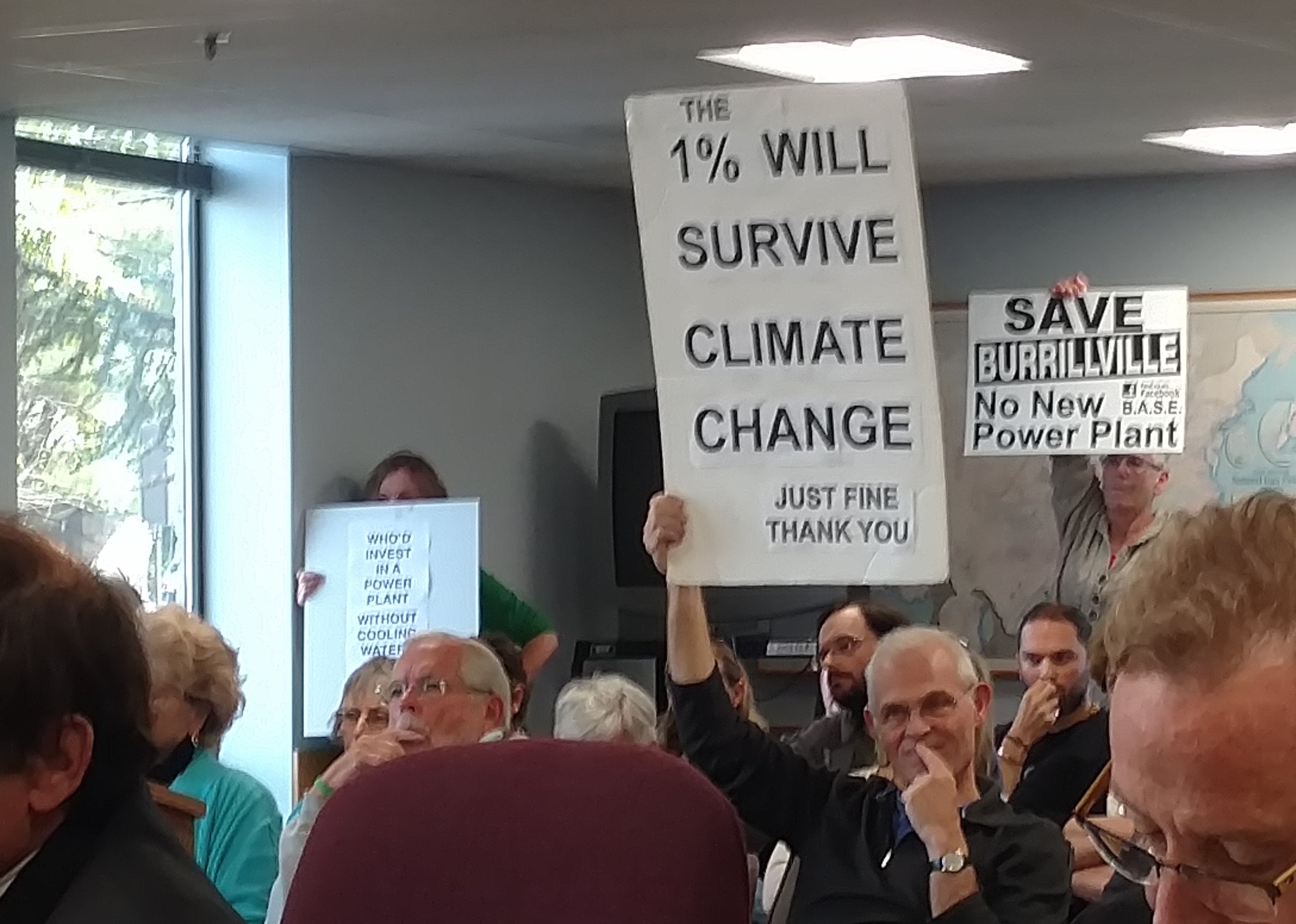 Opponents of the proposed fossil-fuel power plant let their feelings be known during the Oct. 13 hearing. (Tim Faulkner/ecoRI News)