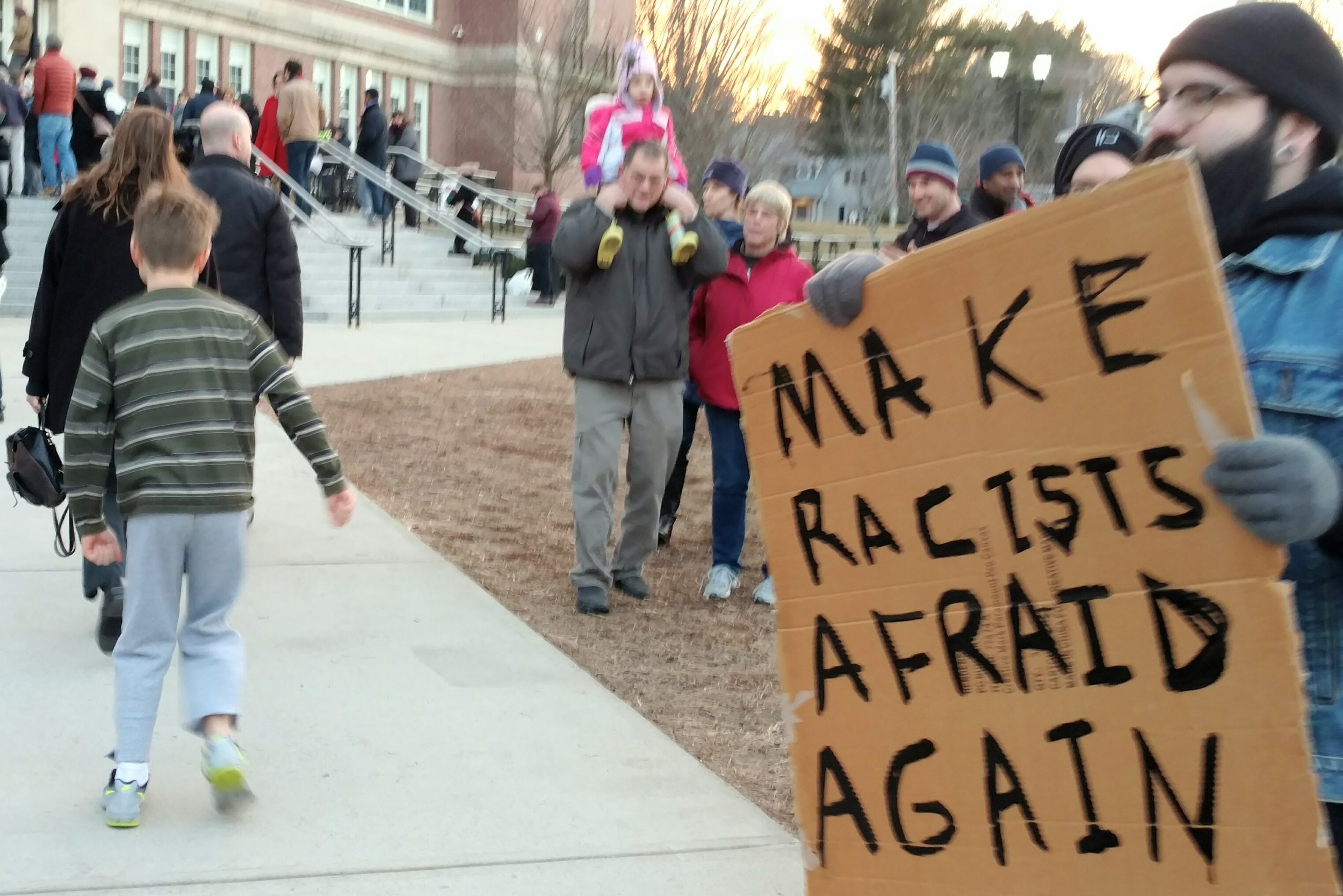 Trump protesters outside the Nathan Bishop Middle School in Providence. (Tim Faulkner/ecoRI News)