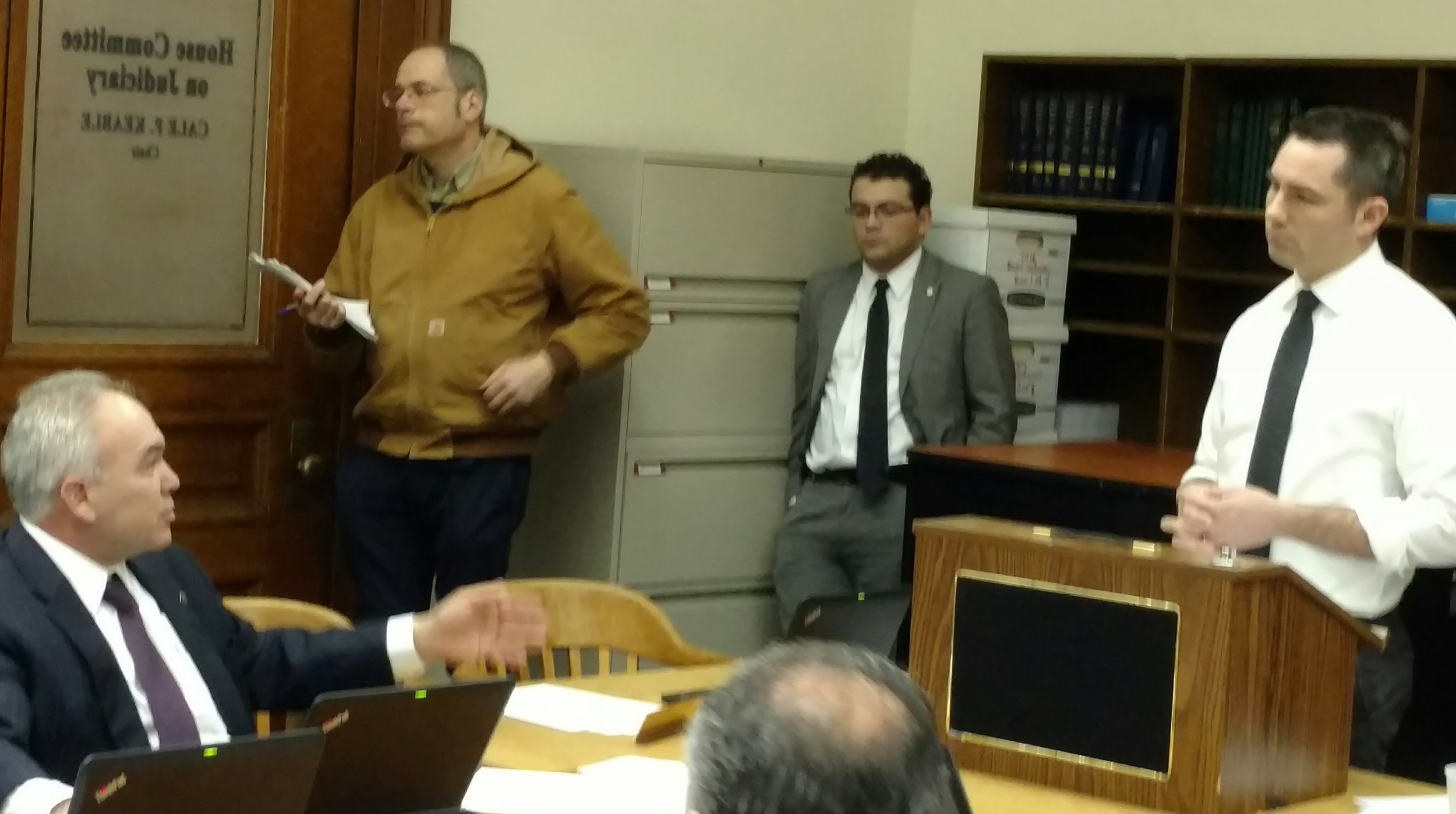 Rep. Justin Price, R-Richmond, left, questions URI assistant professor Aaron Ley during a Jan. 24 House hearing for a bill to shield academic research from public information requests. (Tim Faulkner/ecoRI News)