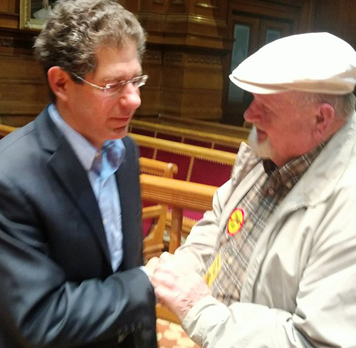 Burrillville resident Ray Putnam Jr., right, thanks Providence City Council member Seth Yurdin for sponsoring a resolution that may curtail water for the proposed Clear River Energy Center. (Tim Faulkner/ecoRI News)