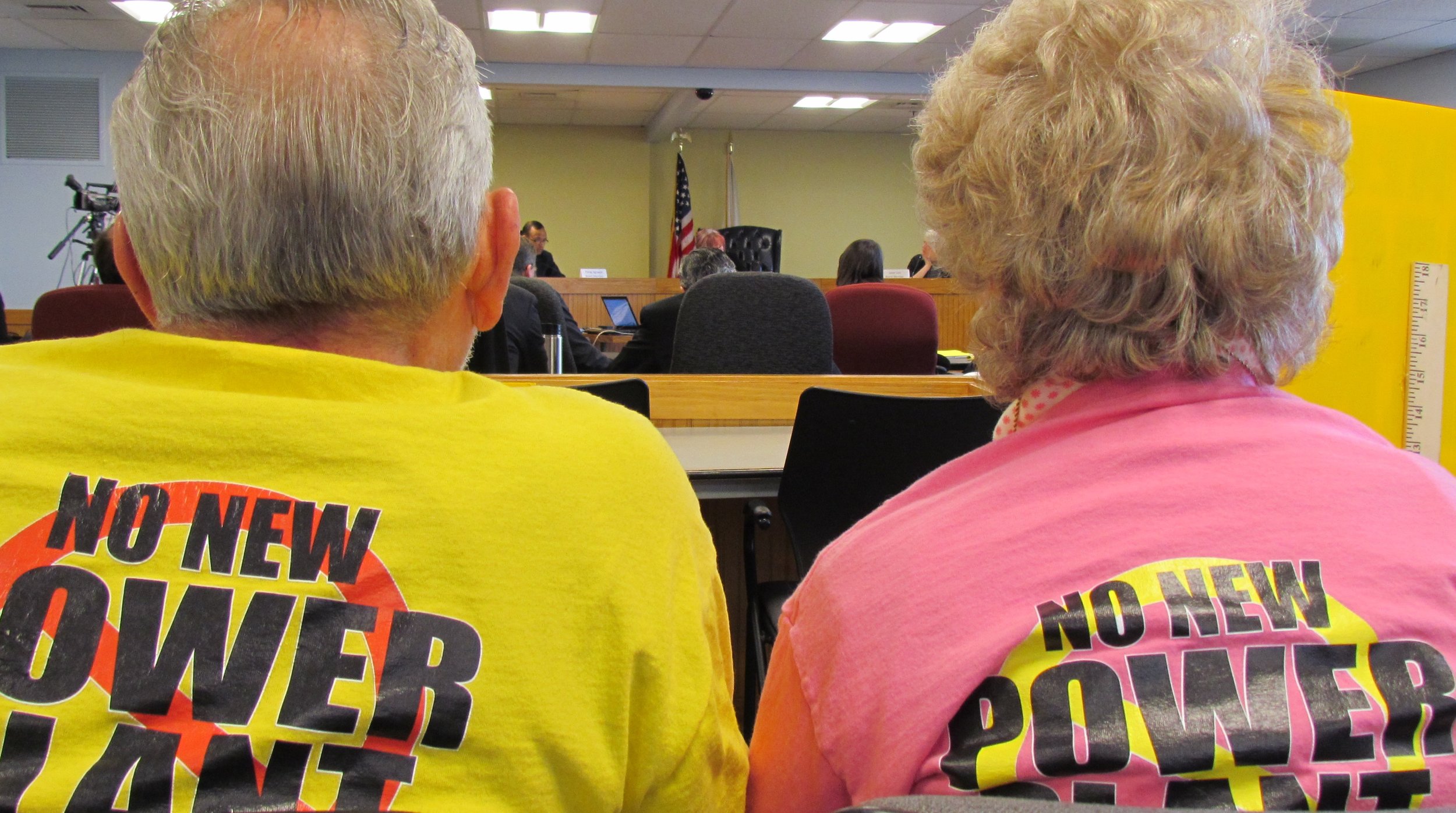 Opponents of the proposed Burrillville fossil-fuel power plant listened carefully during a recent Energy Facility Siting Board meeting. (Tim Faulkner/ecoRI News)