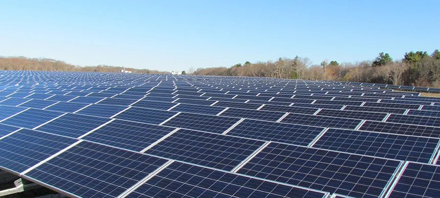 Some 13,000 solar panels sit atop a former landfill in East Providence, R.I., but there is growing pressure in southern New England to develop energy infrastructure on farms and in forests. (ecoRI News)
