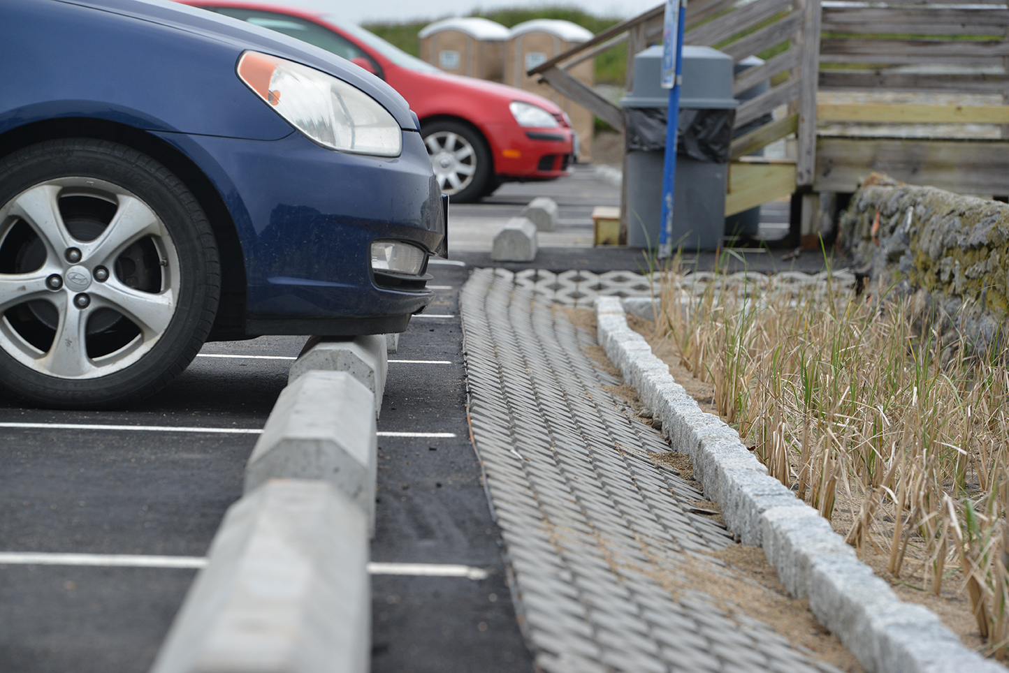 At the Second Beach parking lot, a trench has been filled with native sand, soil and sea grass, allowing runoff to be infiltrated and absorbed.