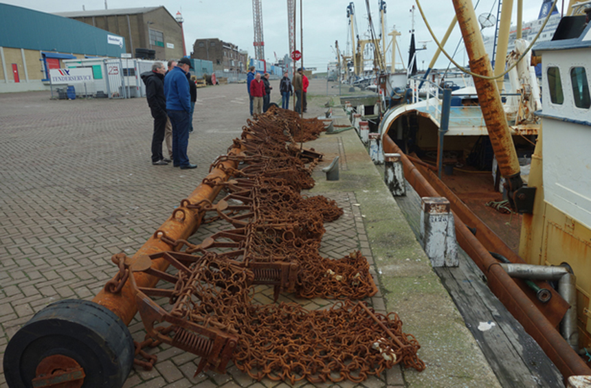 Scallop dredges attached together on a beam at a fishing dock in the Netherlands. (Jeremy Collie)