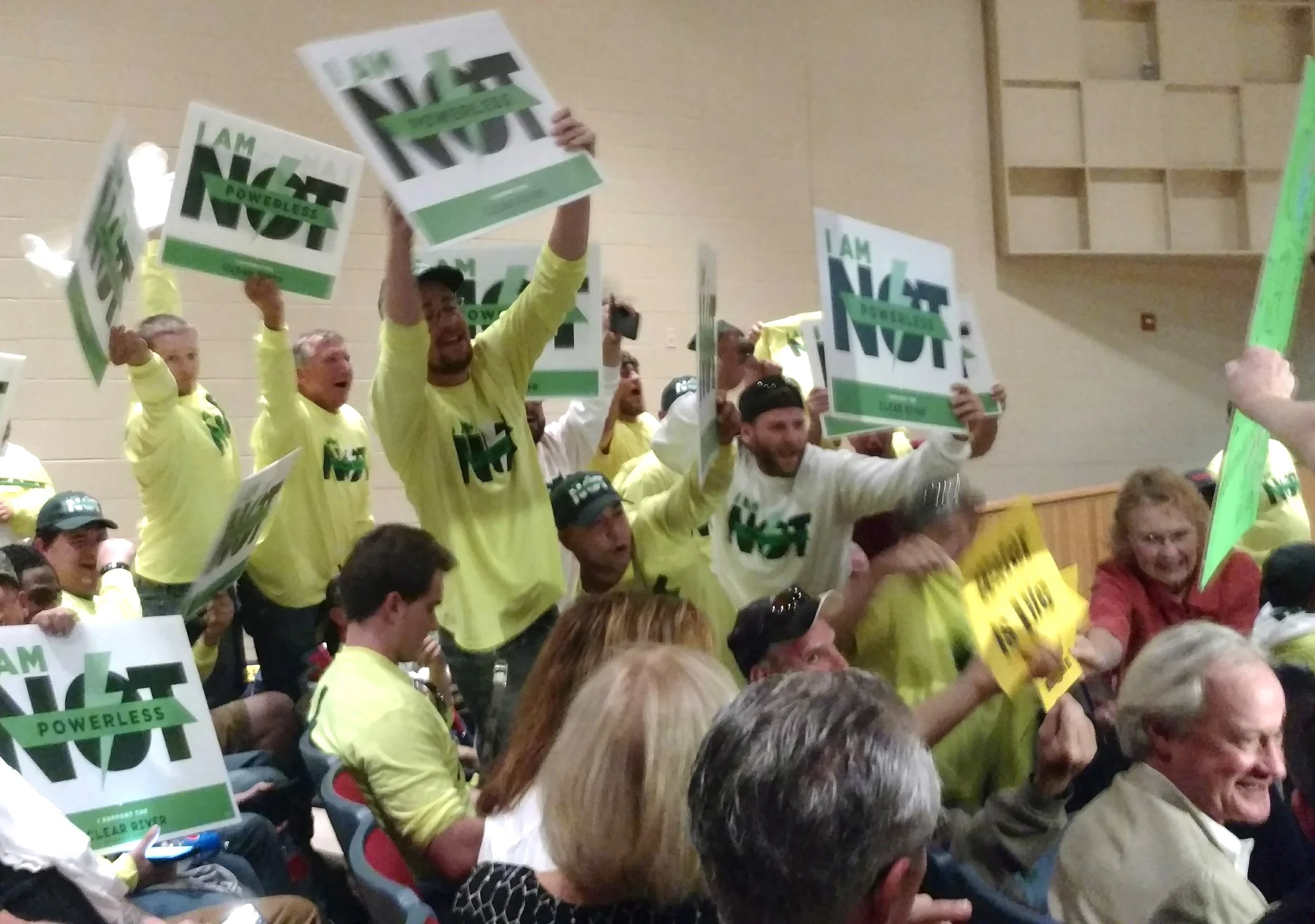Union members who support the power plant had their own T-shirts and signs. They were loud but left early. (Tim Faulkner/ecoRI News photos)