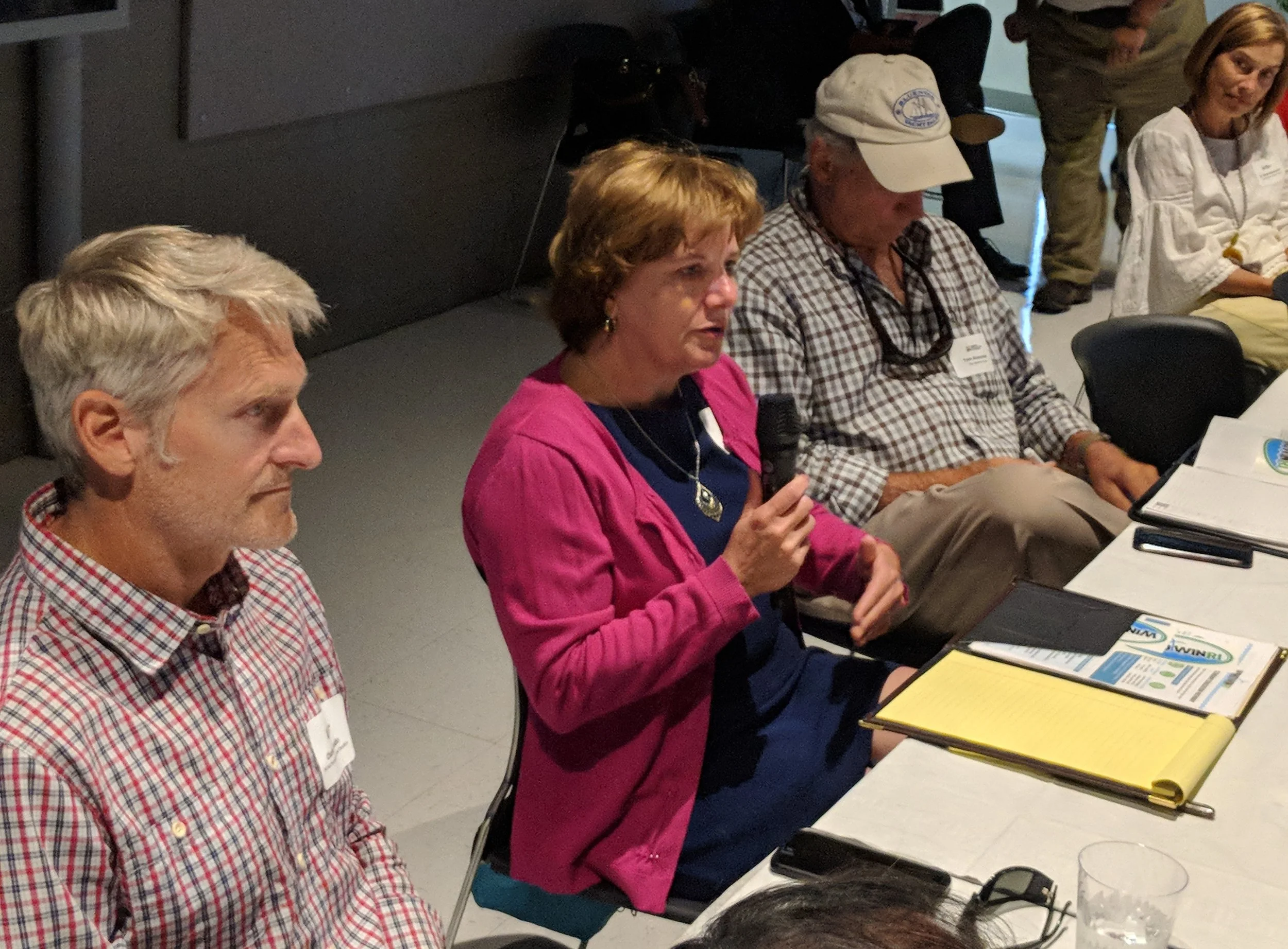 Marine and education professionals discuss a new wind-energy training and education program. (Tim Faulkner/ecoRI News)