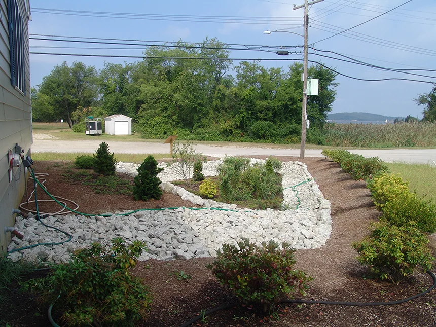 The rain garden at Common Fence Point Community Hall in Portsmouth, R.I., was built in one day with help from 40 volunteers. The garden collects rain from the roof, decreasing flooding and filtering polluted runoff. (Frank Carini/ecoRI News)