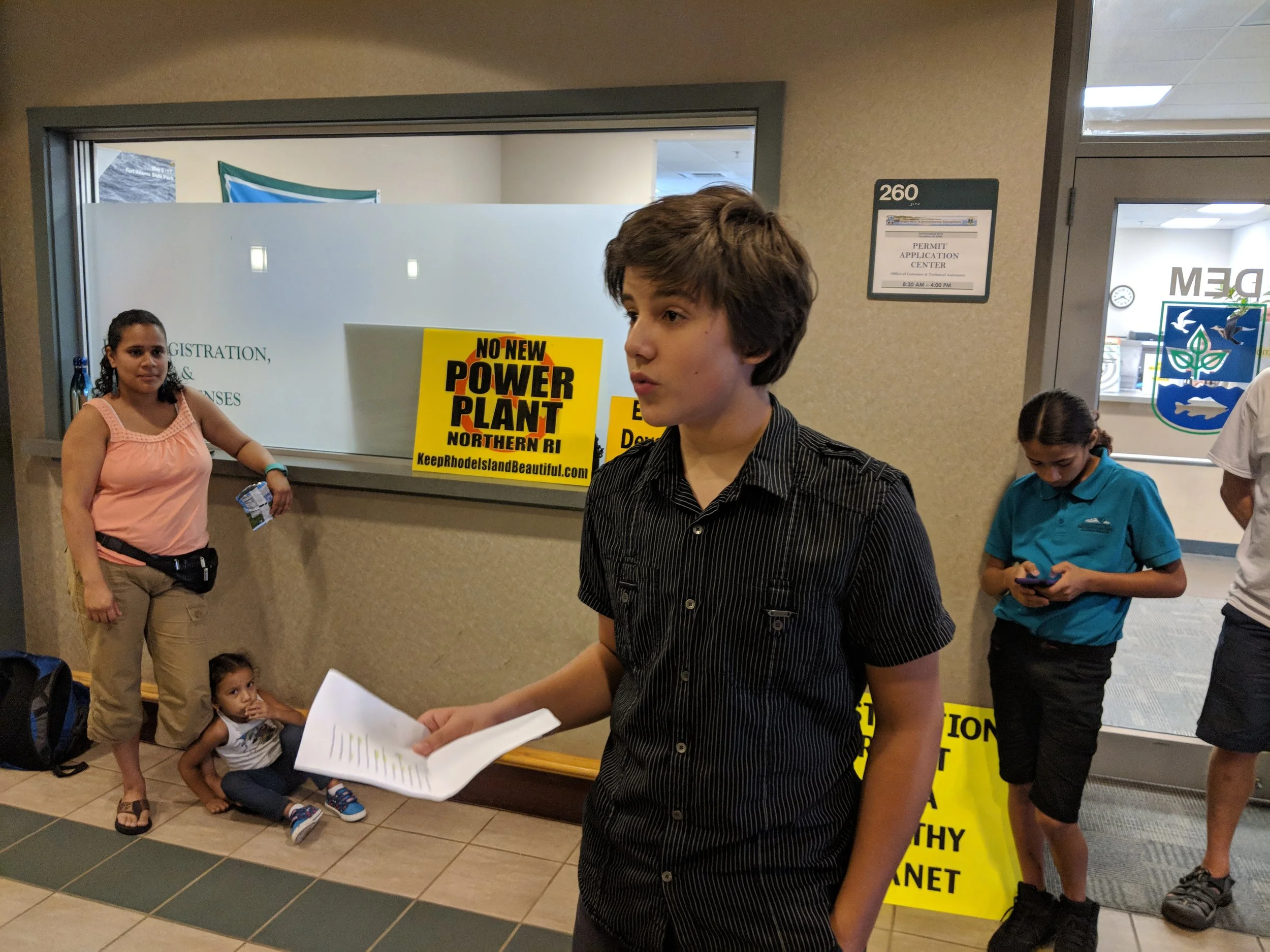 ‘It is so disappointing that the state won't listen to us,’ said Philip Tierney, 14, of East Providence, R.I. ‘Climate change is coming at a rapid pace, and they don't do anything about it. The future looks scary.’ (Tim Faulkner/ecoRI News)
