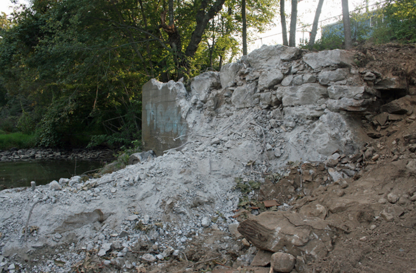 The remains of the White Rock Dam on the Connecticut side of the Pawcatuck River. (ecoRI News)