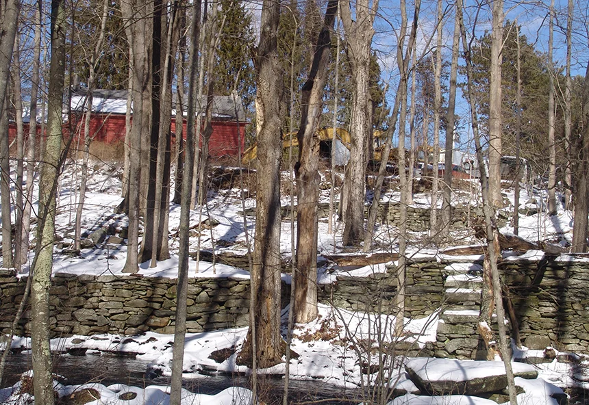 Wright’s Auto Parts is bordered by Hemlock Brook, which, at some spots, is no more than 50 feet from junkyard operations. (Frank Carini/ecoRI News)