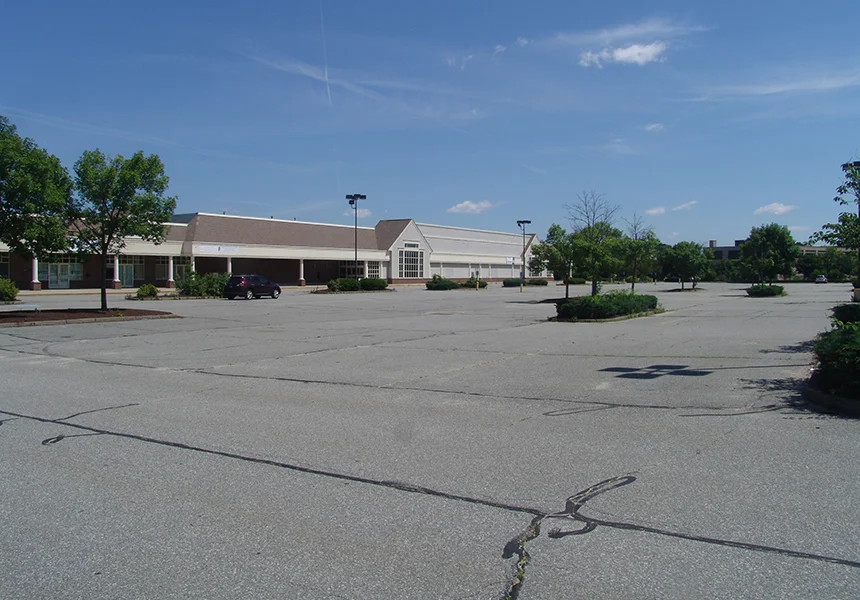 The city’s most recent swath of green space sits behind a essentially vacant strip mall with plenty of pavement.