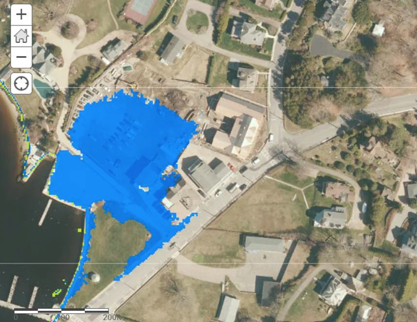 The STORMTOOLS projection for 2 feet of sea-level rise shows that the Watch Hill, R.I., hall where the recent lecture was held would be surrounded by water and the cars in the parking lot underwater. At 3 feet of rise, all of Bay Street would be underwater.