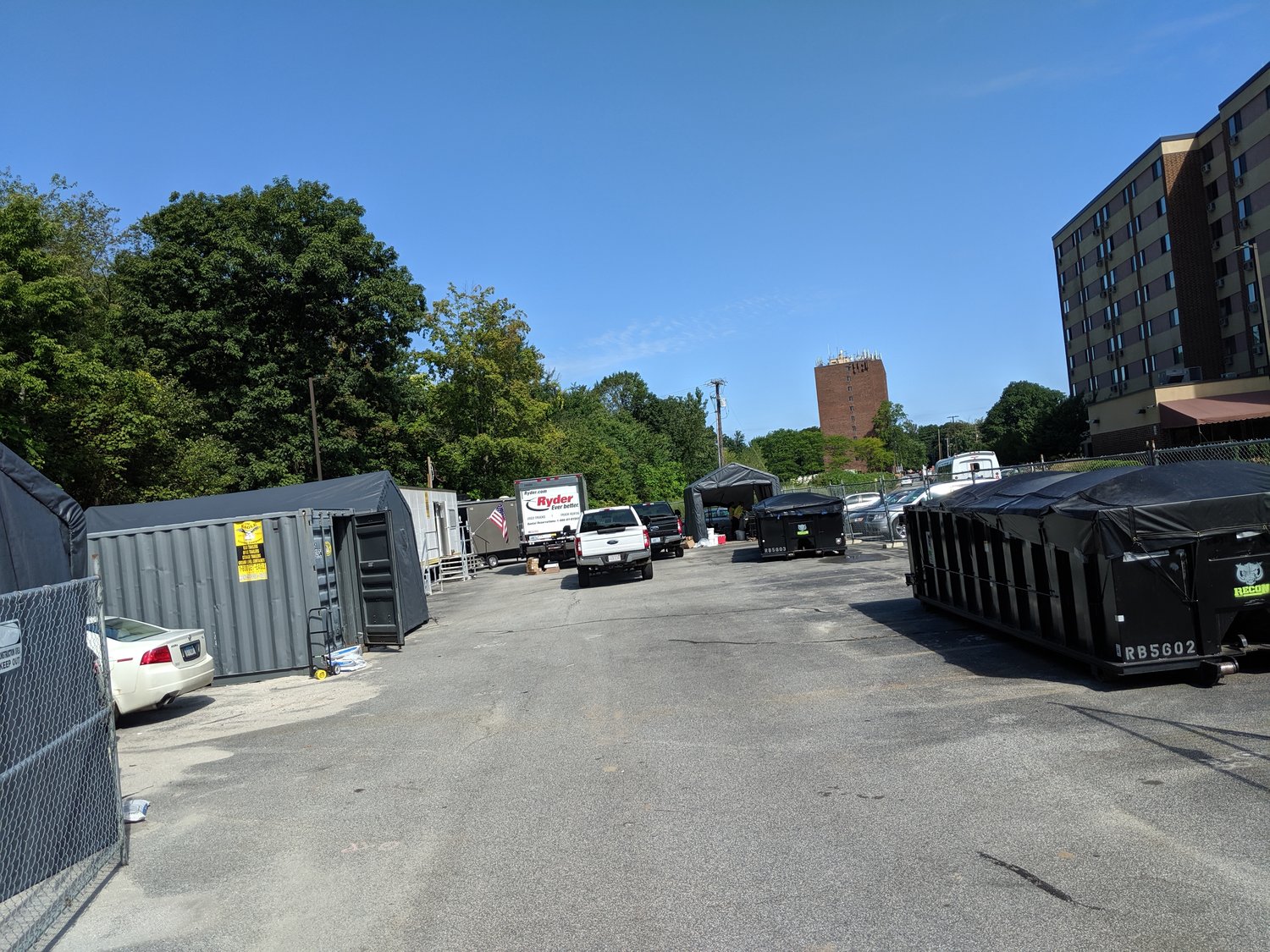 Acres of parking lot will be removed and capped to contain contaminated soil outside Centredale Manor and Brook Village Apartments in North Providence, near the Johnston line. (Tim Faulkner/ecoRI News)