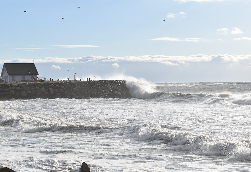 The relentless force of the sea is a venerable foe for human-made structures, such as this seawall at South Kingstown Town Beach. (Frank Carini/ecoRI News staff)