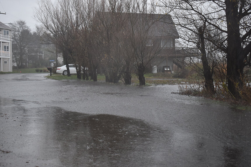 More intense and frequent rains, combined with stronger storm surge and a rising sea level, are routinely flooding coastal areas, such as the Common Fence Point neighborhood in Portsmouth. (Frank Carini/ecoRI News)