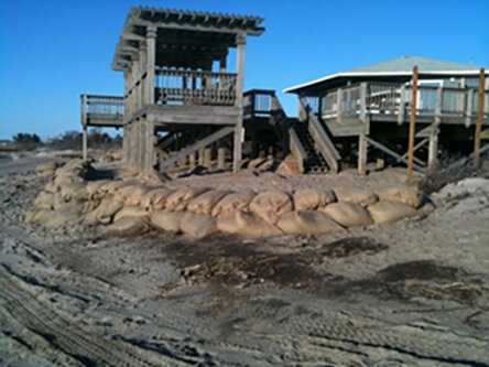 Sand bags line a pavilion at South Kingstown Town Beach.