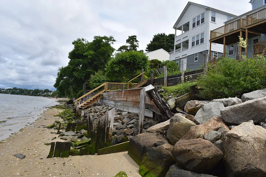 Rocks, wood and concrete are being used along the East Providence shoreline to keep rising waters at bay and to delay erosion. (Frank Carini/ecoRI News)