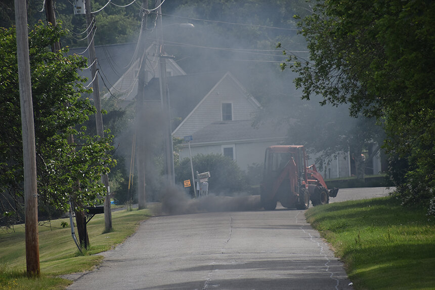 Black smoke from heavy-duty diesel vehicles, such as this non-road tractor driving on a public street in Portsmouth, is a sign that unhealthy levels of particulate matter are spewing into the air. (Frank Carini/ecoRI News)