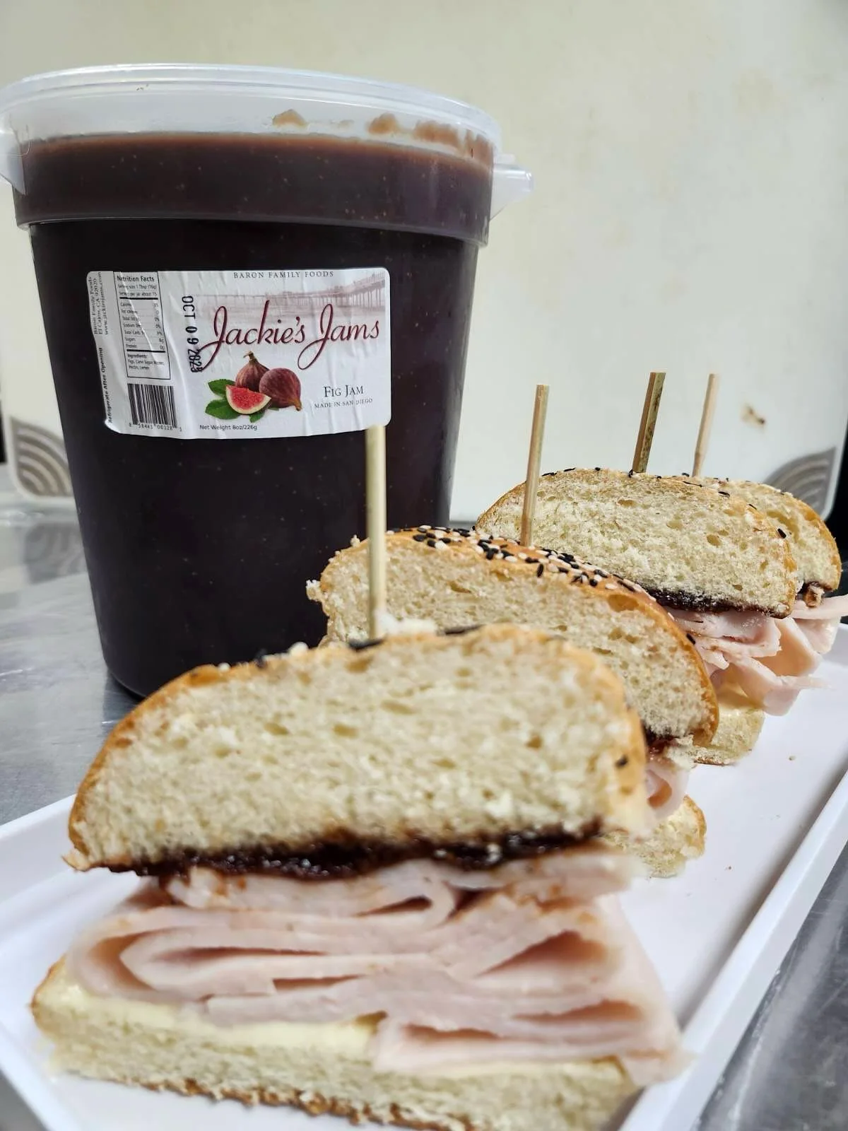 As an @sdsualumni , I am excited that @sandiegostateuniversity Chef Ben uses @jackiesjams catering events.  He created these turkey, Brie and fig sandwiches.  GO AZTECS.