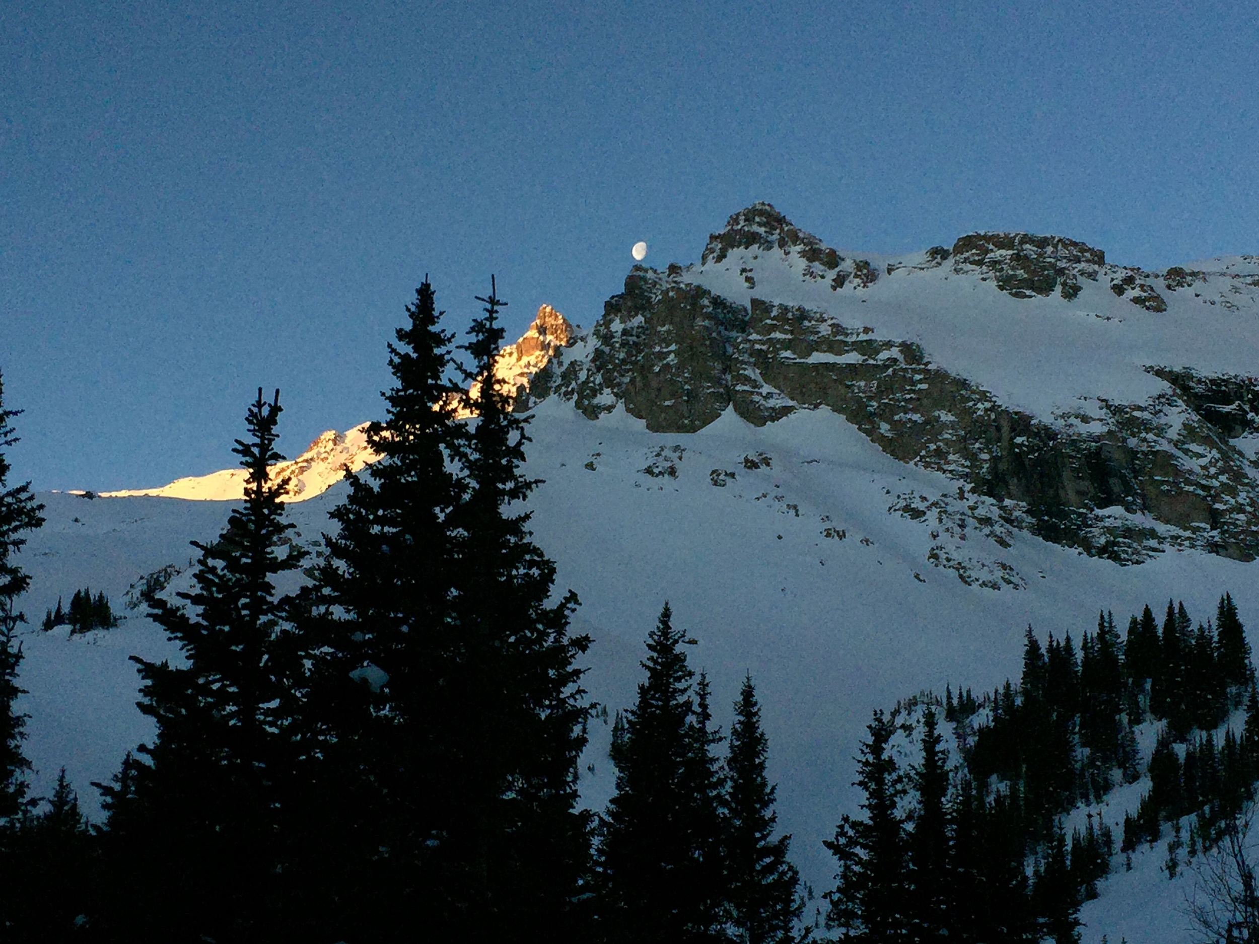 The Moon Sets Behind the Eastern Ridge of 14,278 ft. Castle Peak