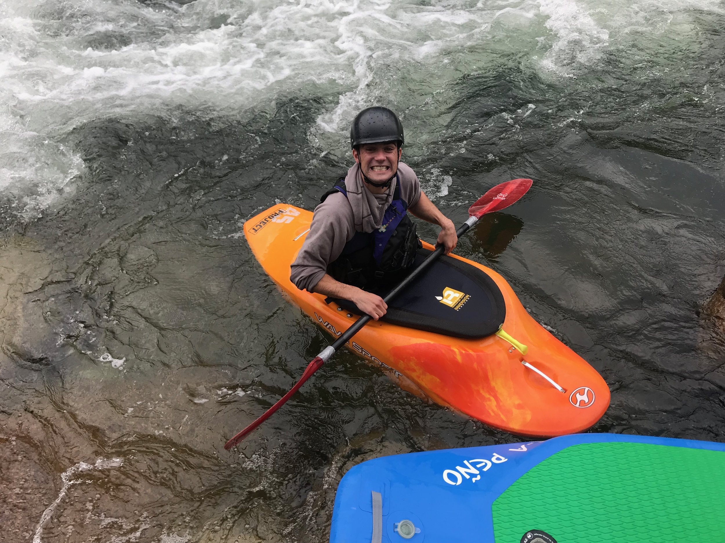 Fletcher is all smiles after taking his kayak for a spin on the wave.
