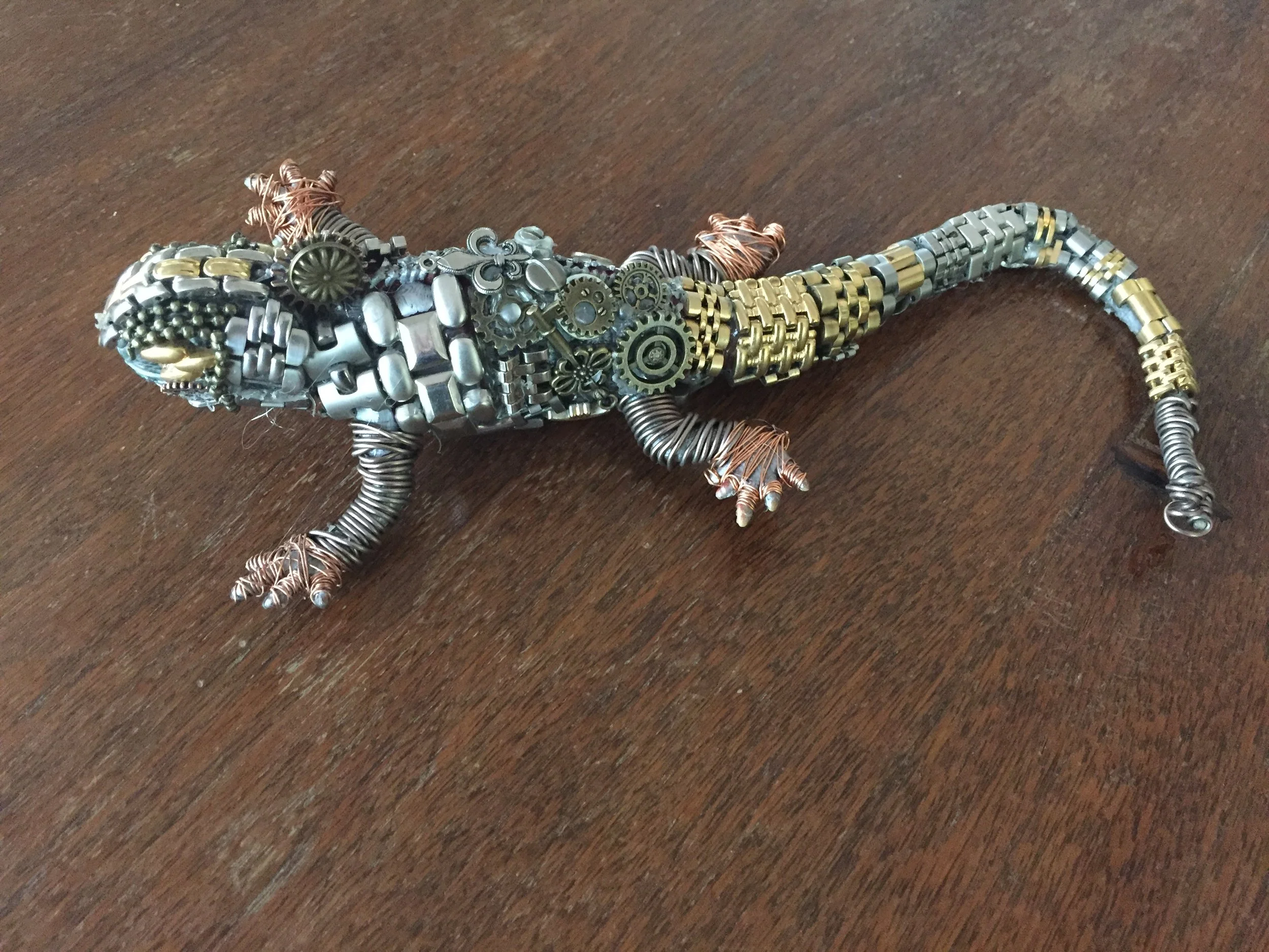  “Rol-X,” ready made  lizard covered in watch parts, clock parts and gears. (2017) 