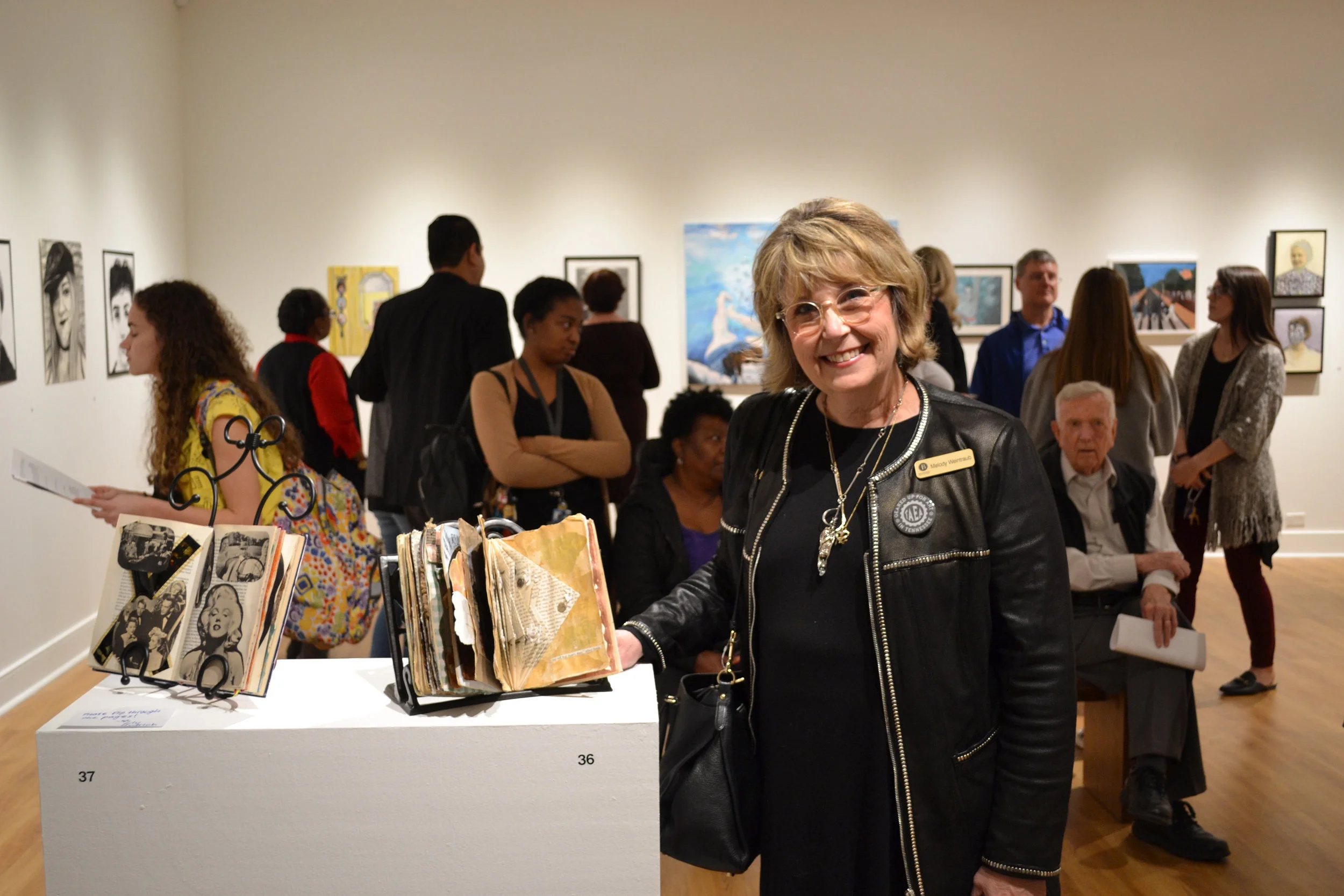 Photo of me at The University of Memphis’ Fogelman Gallery with my Anne Frank Altered Book for the 2018 UM Art Ed Alumni Show.