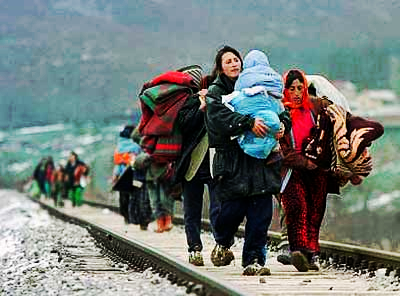 Refugees walk along railways attempting to leave Greece.