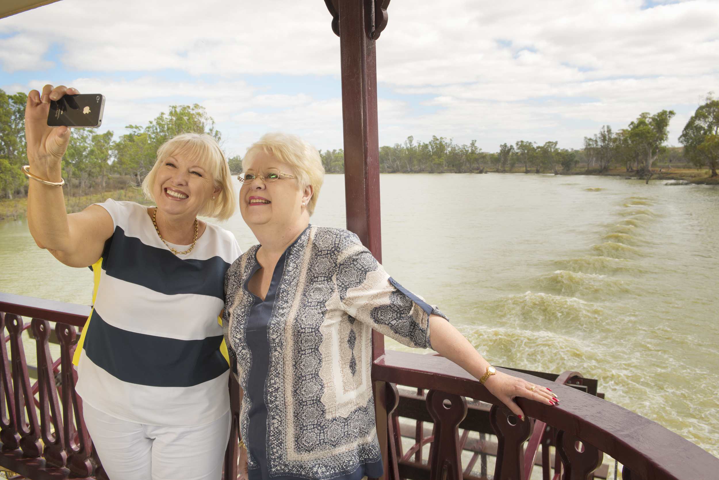 If I cropped closer, we wouldn't know what is so special that requires a selfie. In this case, it's the mighty Murray River while they are cruising.