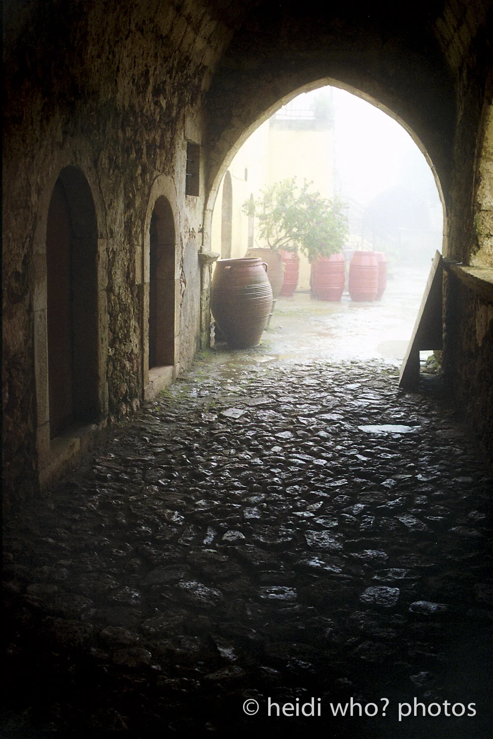 The viewers eye is drawn through the photo to the light through the archway. 