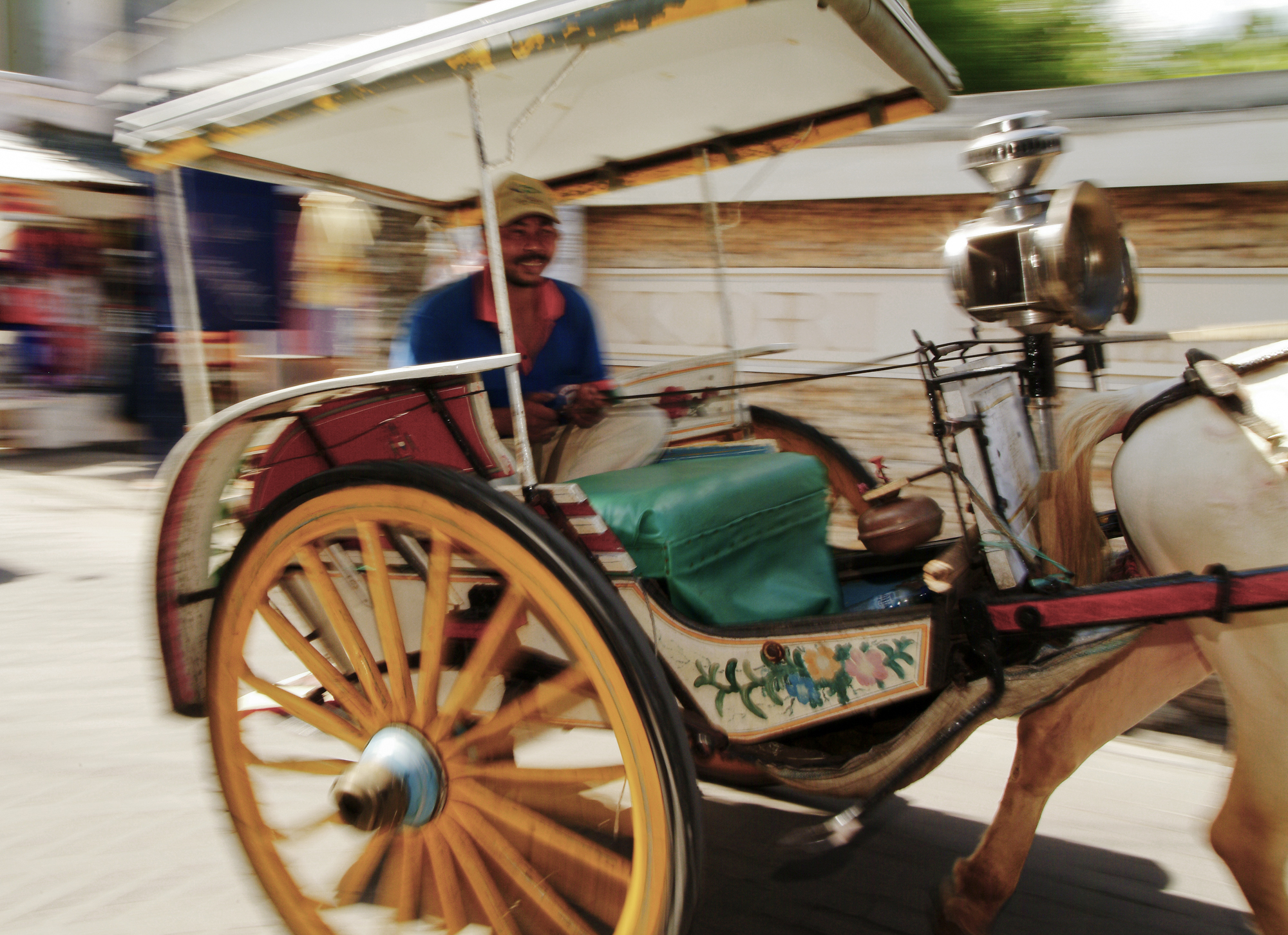 Pan and slow shutter. Move with your subject to keep them in focus and sharper and add blur around them. 