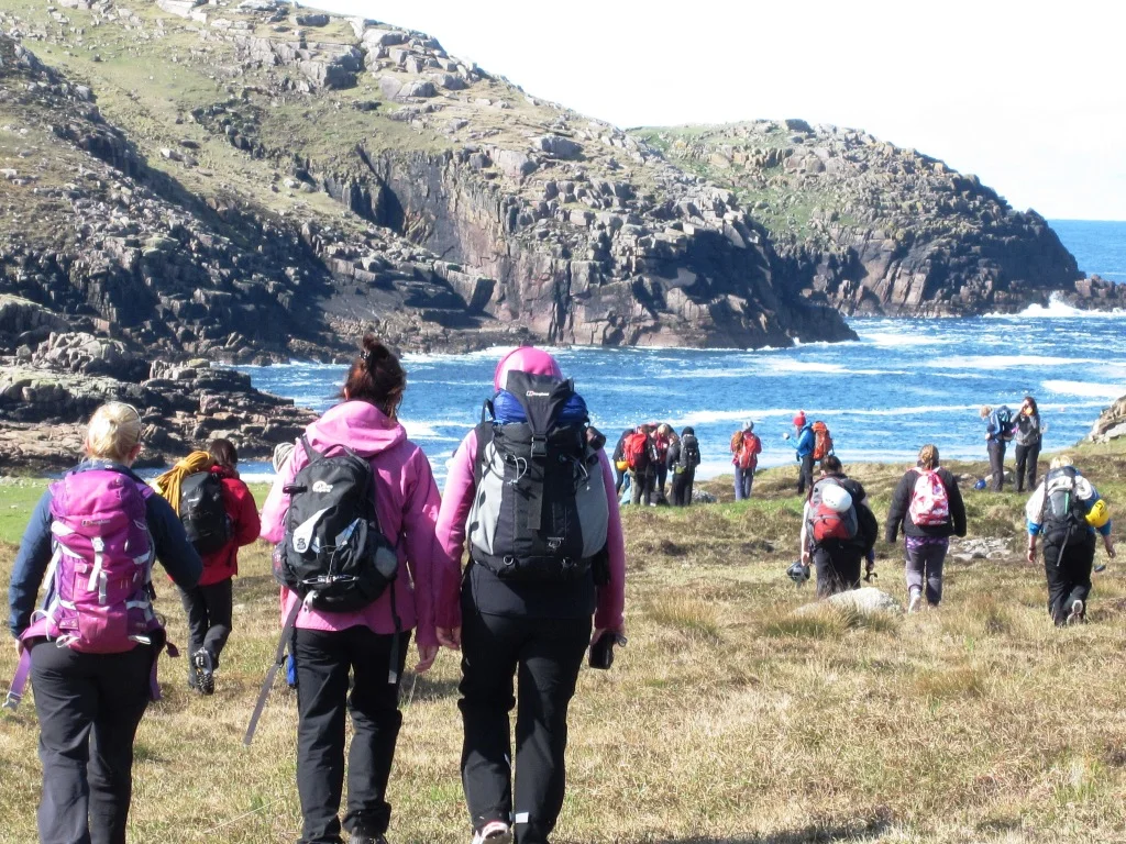 Climbers on their way to the crag Gola Island.jpg