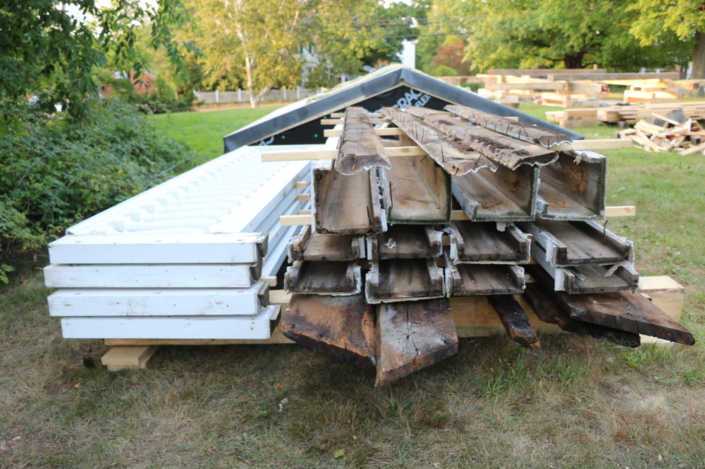  Meanwhile the removed trim boards (probably original, 1824) and railings (from the 1990’s) are stacked and will eventually be moved to a storage conainer. 