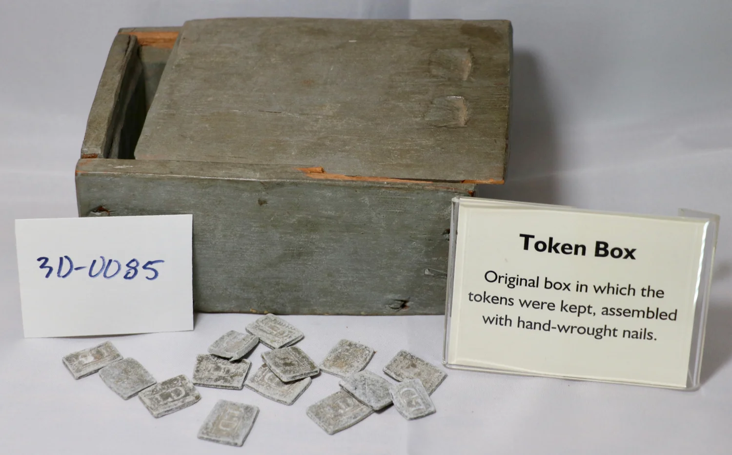 In the historic Presbyterian years, parishioners who could prove themselves worthy in advance would receive a token; placing one’s token in the box was required to receive communion.
