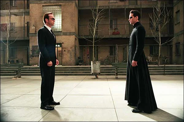 Neo: Do you ever feel like the world we live in is- Agent Smith: Hello! Would you care for some free chili cheese dogs and beer? Neo: WHOA! Hell Ya! Thanks! What was I talking about again? Agent Smith: Doesn't matter. Look, Big Bang Theory is on. Neo: Oh sweet, Bazinga!