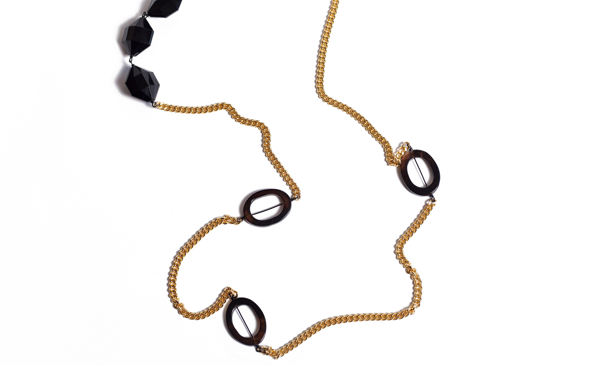 Begin by choosing your anchor. I chose the 48 inch Clancy necklace from The Lexie Collection. Your anchor is the longest necklace you plan to use. I recommend that it be about 48 inches or more so that you can have the option of doubling it. If you use a necklace that is more than 50 inches and has a clasp, you would also have the option to wrap it around three times.