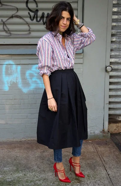 MENSWEAR is another significant trend. This model rocks menswear in a funky way hiding her skinny jeans under her woolen skirt. Note the menswear striped shirt and the unexpected red stilettos. You love MENSWEAR, but you're not that funky? Then try this look without the addition of the skirt.