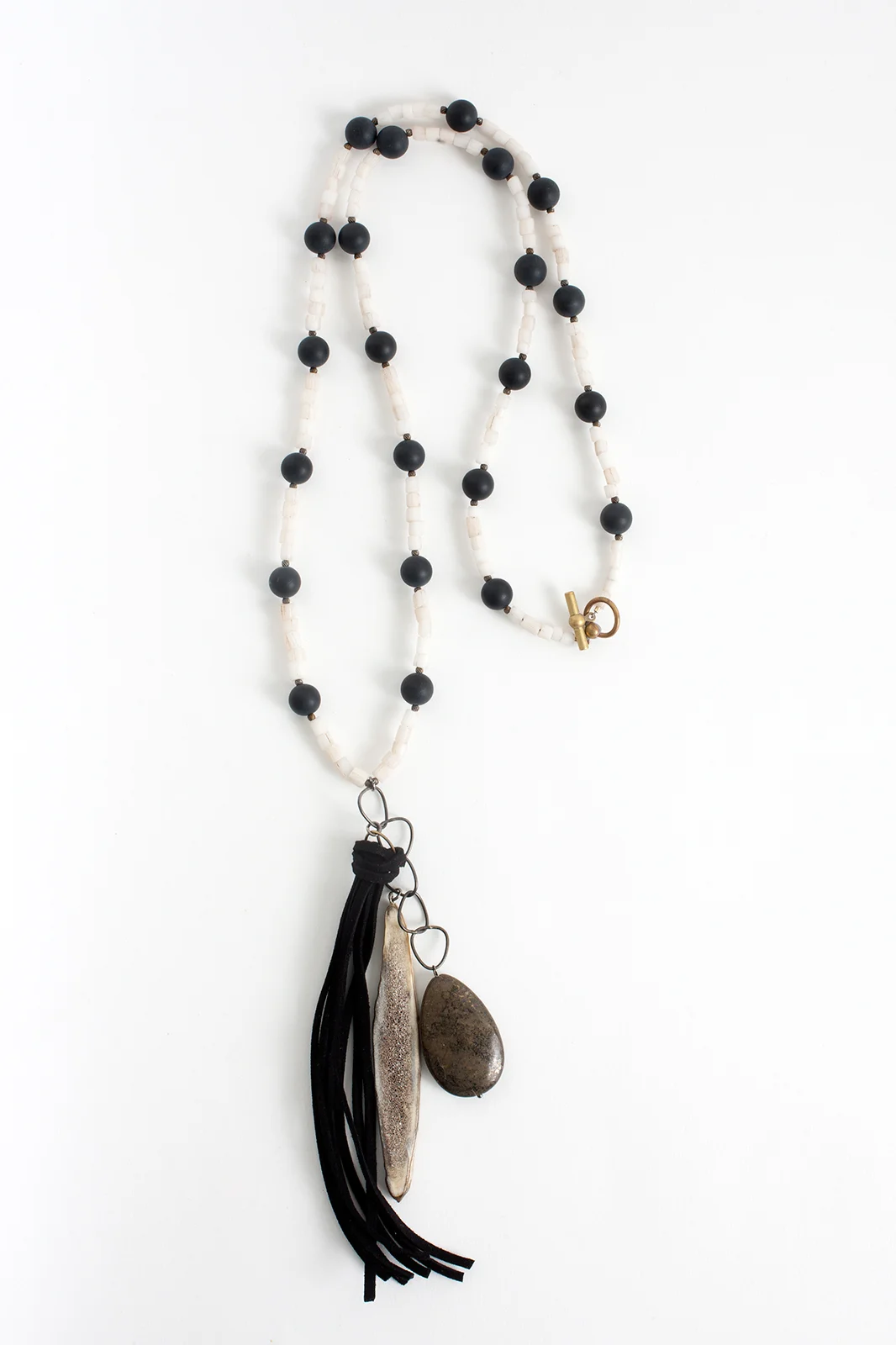 Our Jeremiah necklace in black and white is just the answer to VICTORIAN GOTHIC. We love how the quirky antler slice adds to the mix.