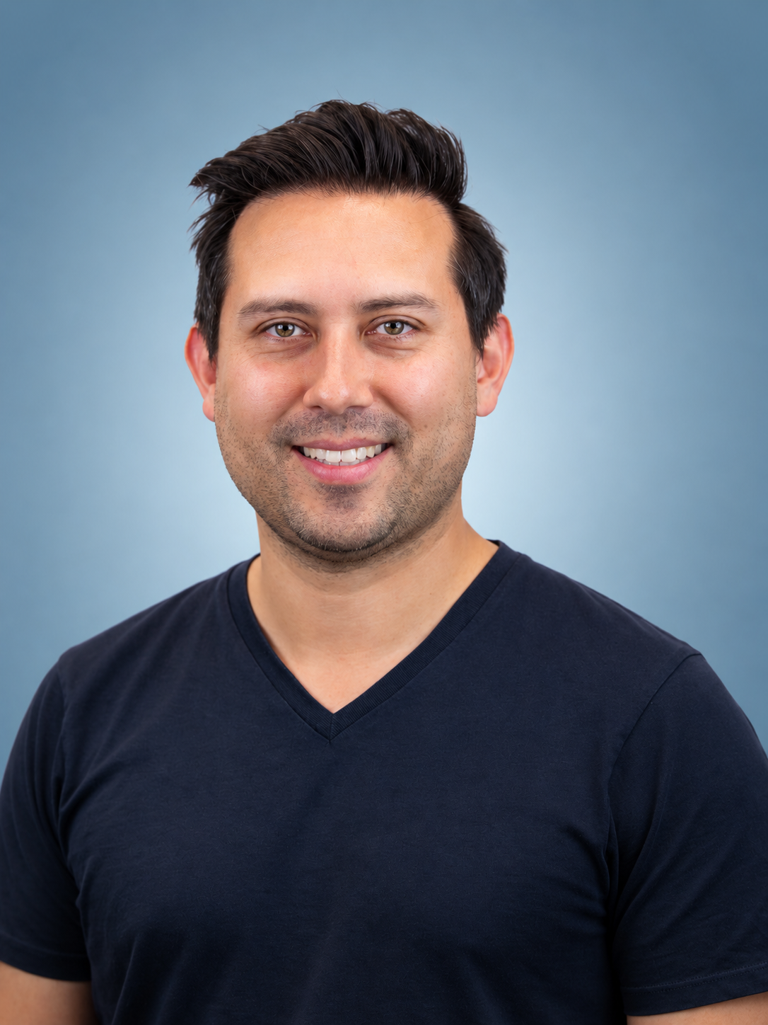 Friendly Corporate Headshot on Blue Gradient.png