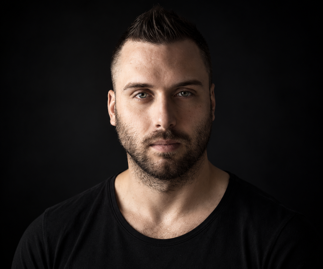 Moody Studio Portrait of a Bearded Man.png