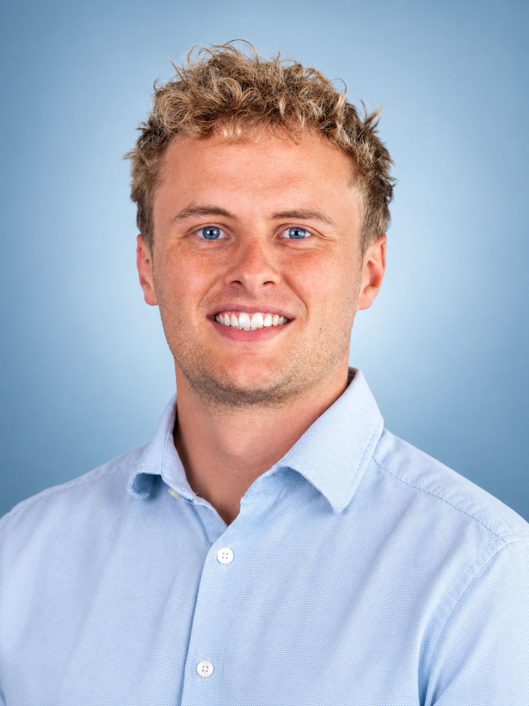 Polished Blue-Eyed Corporate Headshot.png