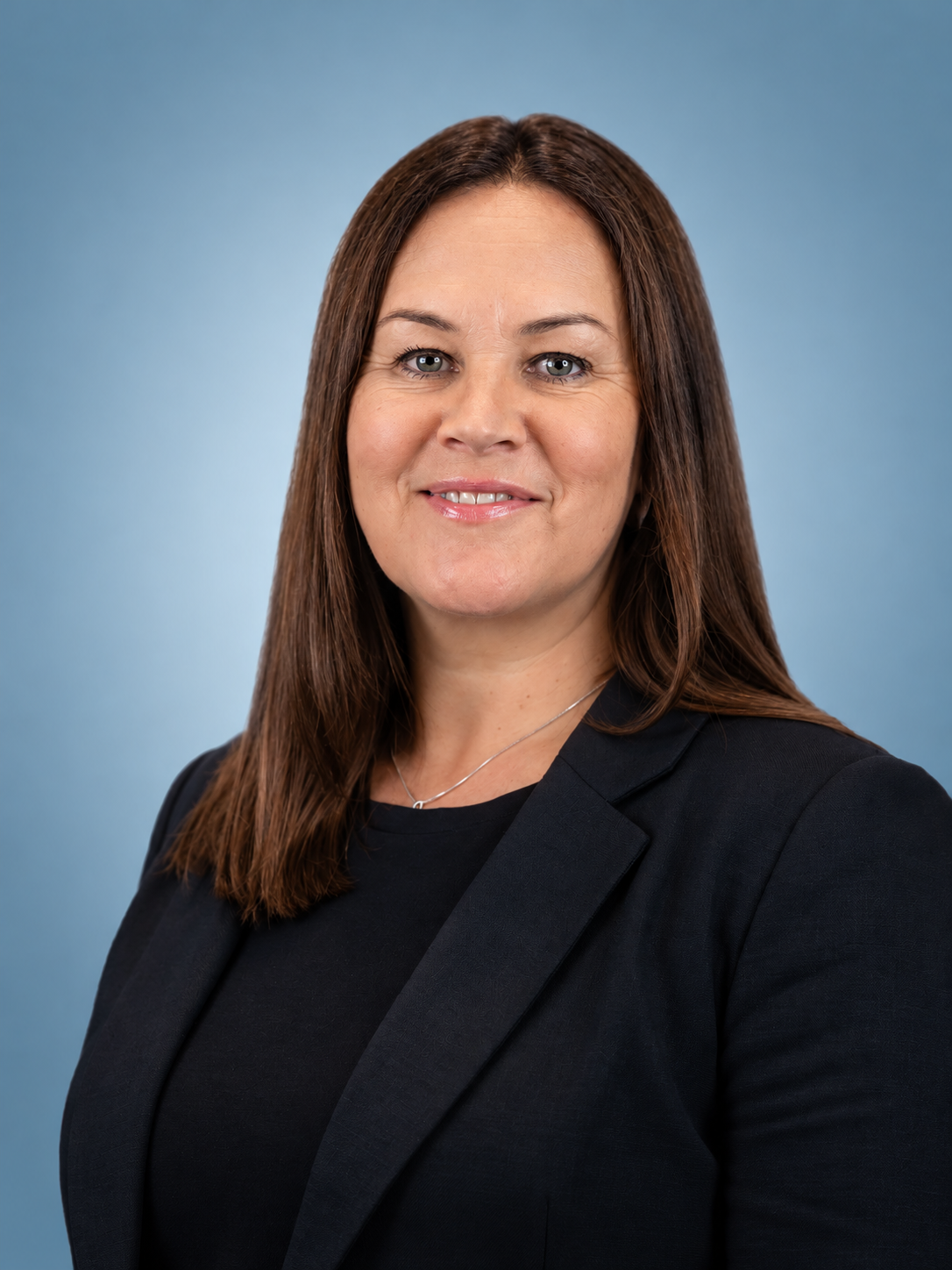 Polished Corporate Headshot on Blue Gradient.png