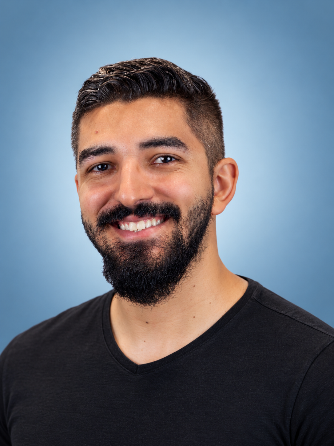 Professional Headshot on Blue Gradient.png