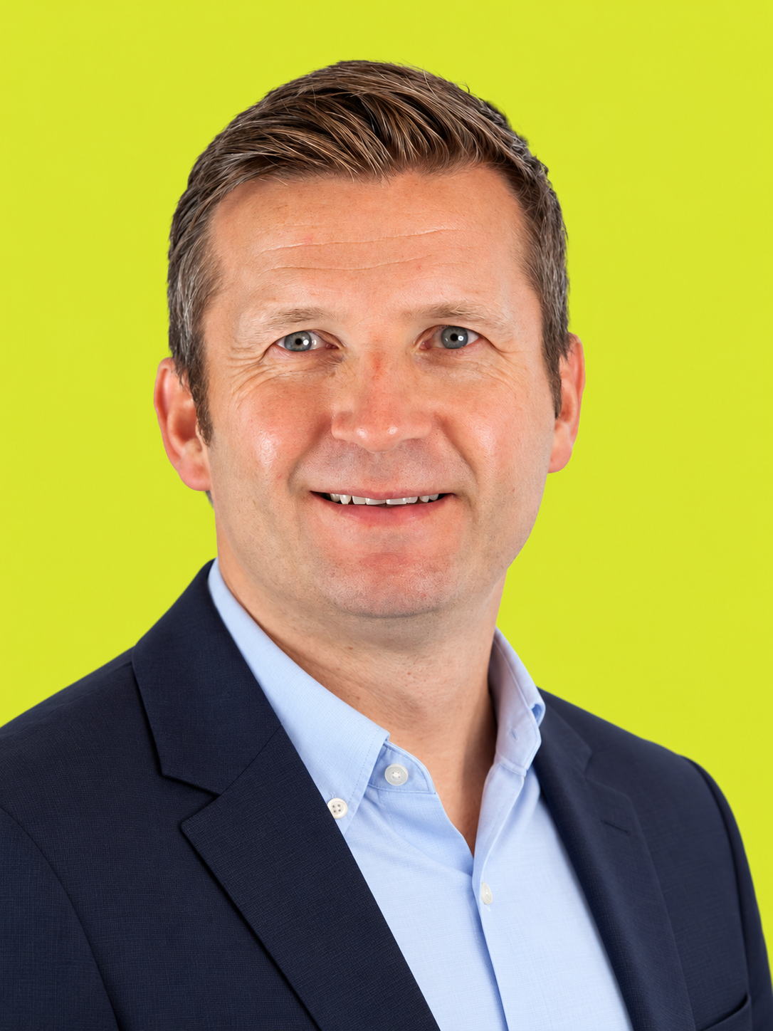 Professional Headshot on Lime Background.png