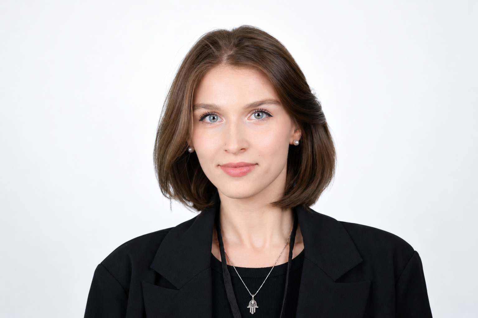 Professional Headshot with Hamsa Pendant.png