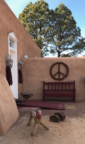 Peace from New Mexico. Notice the wooden lamb wearing a red scarf.