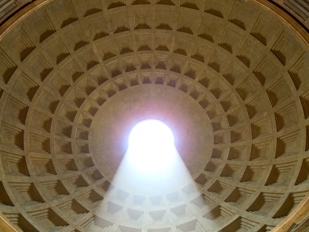 THE CEILING OF THE PANTHEON IN ROME, CAPTURED WITH A SHAFT OF LIGHT SHINING THROUGH THE OPENING