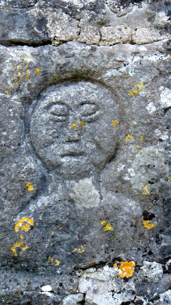 Stone carving near a sacred well in Ballyvaughan, County Clare, Ireland