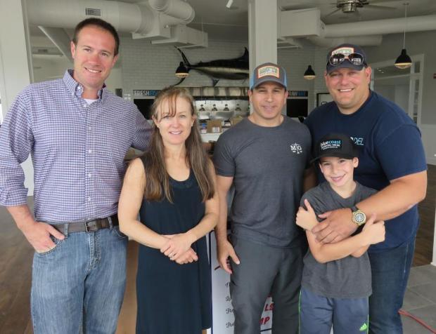 A rare quiet moment at Bluecoast Rehoboth with (l-r) SoDel Concepts Director of Operations Matt Patton, Marketing/PR guru Nelia Dolan, SoDel Concepts longtime counsel Bryan Mintz, Bryan's son Michael, and SoDel Concepts CEO/President Scott Kammerer. BOB YESBEK PHOTO
